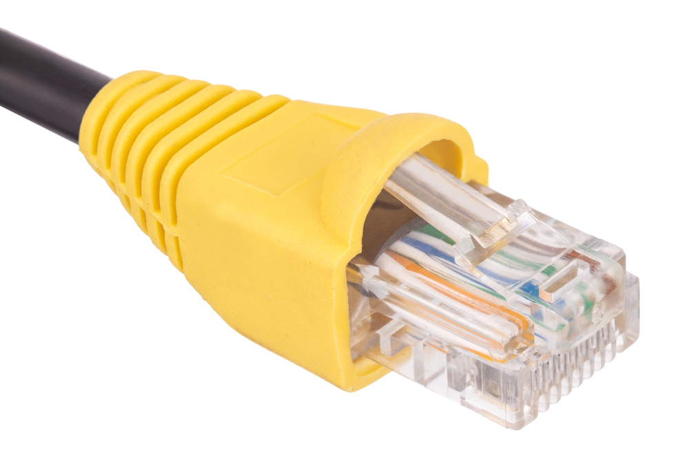 Close-up of a yellow Ethernet cable with an RJ45 connector, showing the colored internal wires and plastic plug against a white background.